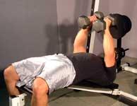 Lower dumbbells out to each side of your chest in a semicircular motion.