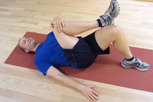 Push your leg away from your head (as shown). Hold for 30 seconds, and 3 repetitions per side.