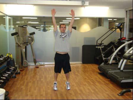 Explode up and extend your body onto your toes, raising your arms overhead.