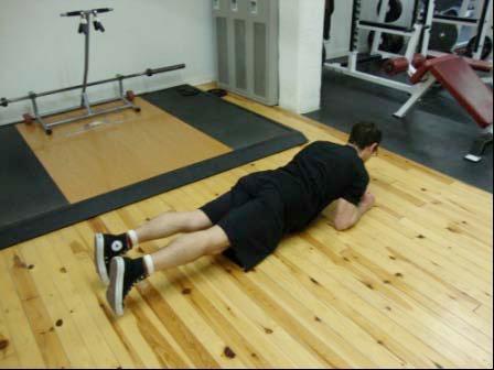 the mat. Keep your back straight and your hips up. Hold (brace) your abs tight.