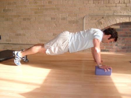 Exercise Descriptions Warm-up Elevated Pushups Keep the abs braced and body in a straight line from knees to shoulders.
