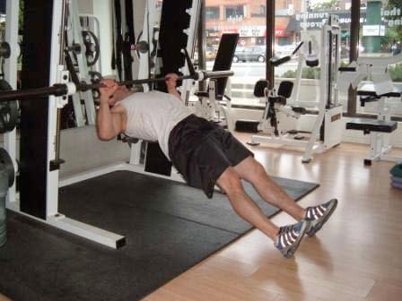 Inverted Rows Set a bar at hip height in the smith machine or squat rack.