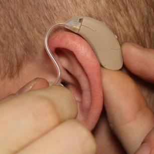 Placing the unit in the ear First, look for the colored marking on the ear tube.