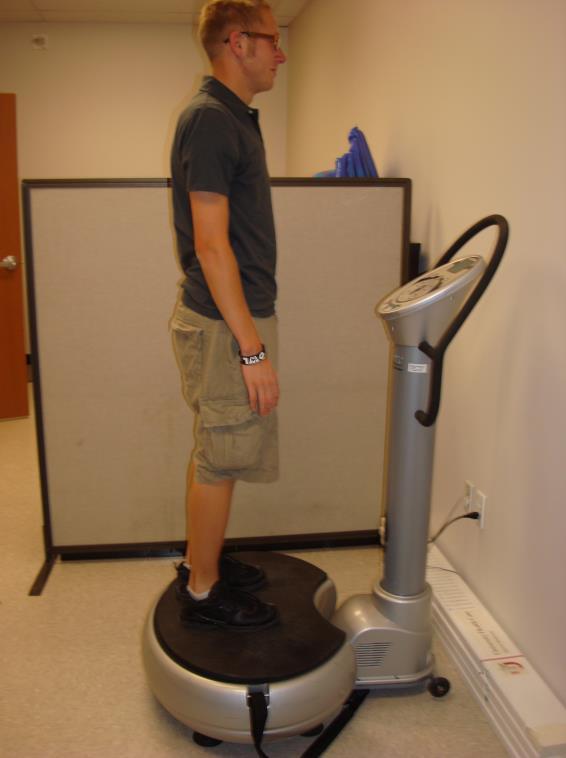 of the subject in the up part of a push-up position with hands shoulder width apart on the vibration plate and feet stationary on the ground (Figure 1b).