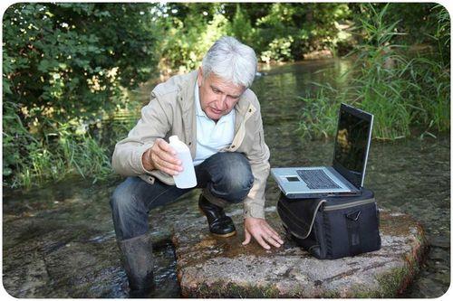 www.ck12.org 5 http://transcanada.essentialtalk.com/media/7/. FIGURE 1.4 This environmental chemist is investigating causes of river pollution. He is collecting and analyzing samples of river water.