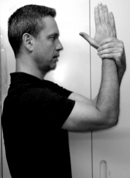 Keep shoulder blades squeezed as you gradually raise your arms higher, try to slide fingertips up the wall as
