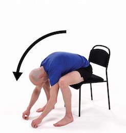 Static Stretch- Seated Lumbar Flexion While seated in chair with feet spread apart, gently lean forward letting your arms hang toward the ground