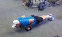 Maintaining a straight line and your abs braced, perform a pushup by