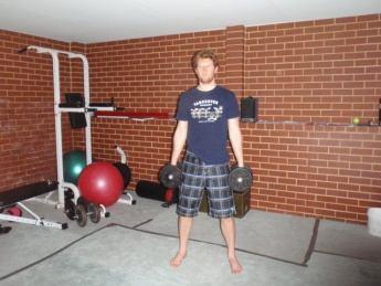 Perform a dumbbell squat and then once you are standing again, curl the dumbbells up to your