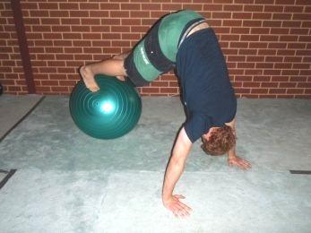 Stability Ball Shoulder Push-ups Start with your feet on a stability ball and your hands slightly wider than shoulder width on the ground.