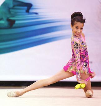 Gymnasts also leap and jump through the open or folded rope, held by both hands.