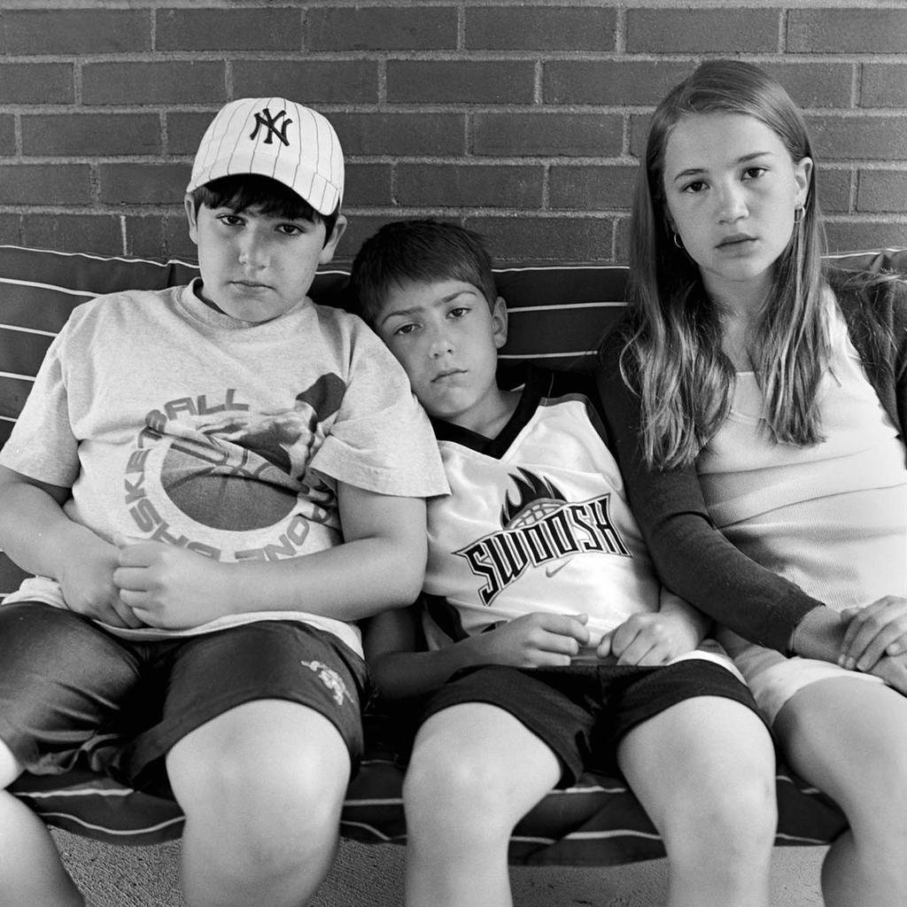 Three of Pat Strobel s five grandchildren 11-year-old twins Nicholas and Samantha (left and right) and Tommaso, 8 sit on the porch swing where Pat