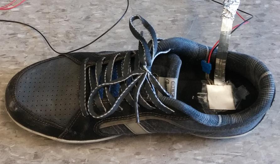 Force and Ultrasonic Sensors Figure 5.9 Wearable ultrasonic and force sensors attached onto the shoe sole at heel part.