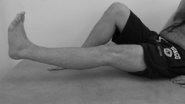 Tighten your thigh muscles as previously and keep your leg straight and lift leg off the bed a small height. Hold for two seconds, then slowly lower it.