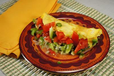 Recipes to Try Spanish Omelet Ingredients 1 tablespoon chopped onion 1 tablespoon chopped green pepper ½ tablespoon olive oil 3 eggs or egg substitutes, lightly beaten ¼ cup chopped tomato Directions
