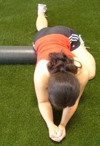 Posterior shoulder and latissimus with axilla stretch: position hold for 15 seconds. This can be done with 2 foam rollers Position foam roller to the left side of your body while in Child s Pose.