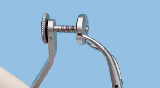 There are holes in the outer surface of the cheek retractor that are designed to facilitate a secure hold with forceps.