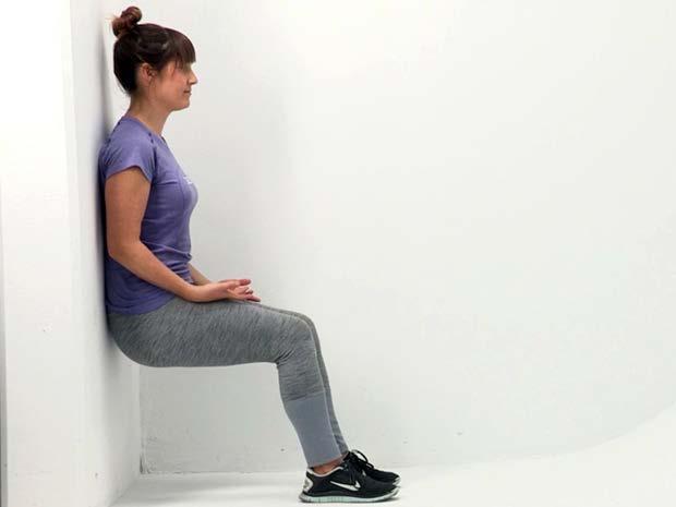 4. Airbench 1. Stand with your back against a wall with feet and knees hip width apart and feet pointed straight. 2. Walk your feet away from the wall while sliding your body down at the same time.