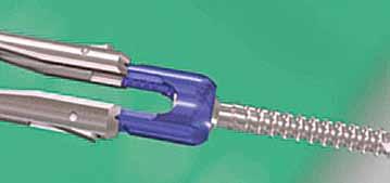 15 Place the tulip head of the screw into the distal tip of the Screw Extension and push the two