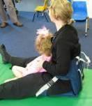 -Sitting on camp or low back chairs can assist with optimal posturing and comfort for you while assisting your child on the floor.