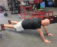 Stability Ball Rollout (see above) Hand Walk-out Assume the pushup position