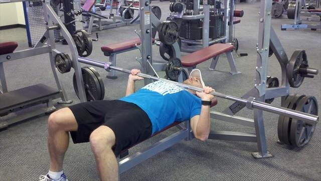 BB Chest Press 1. Keep your feet flat on the floor, legs bent, and upper back flat against the bench. 2.