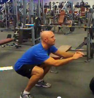Start the movement at the hip joint. Push your hips backward and sit back into a chair.