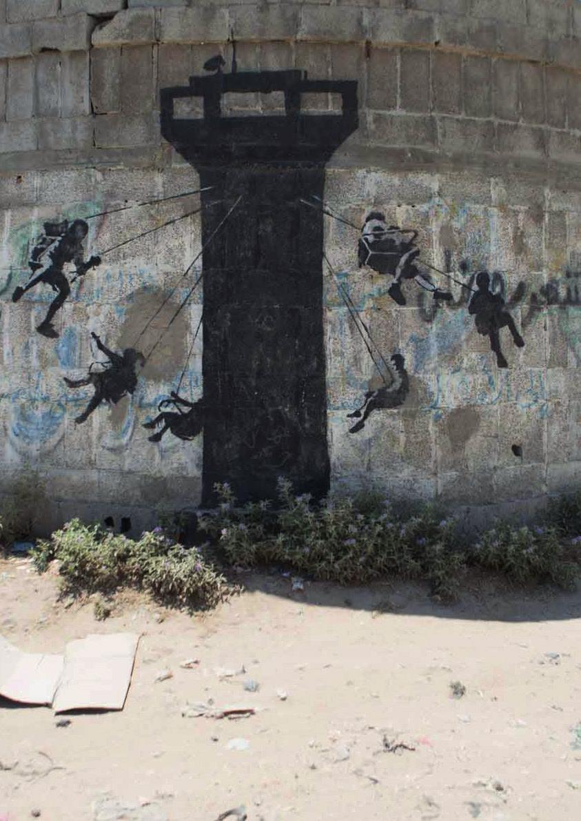 One of Banksy s murals on a wall in