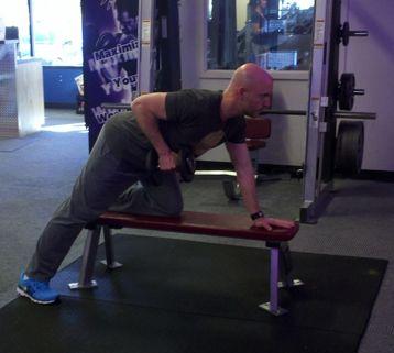 Hold the dumbbell in the right hand in full extension and slowly row it up to the