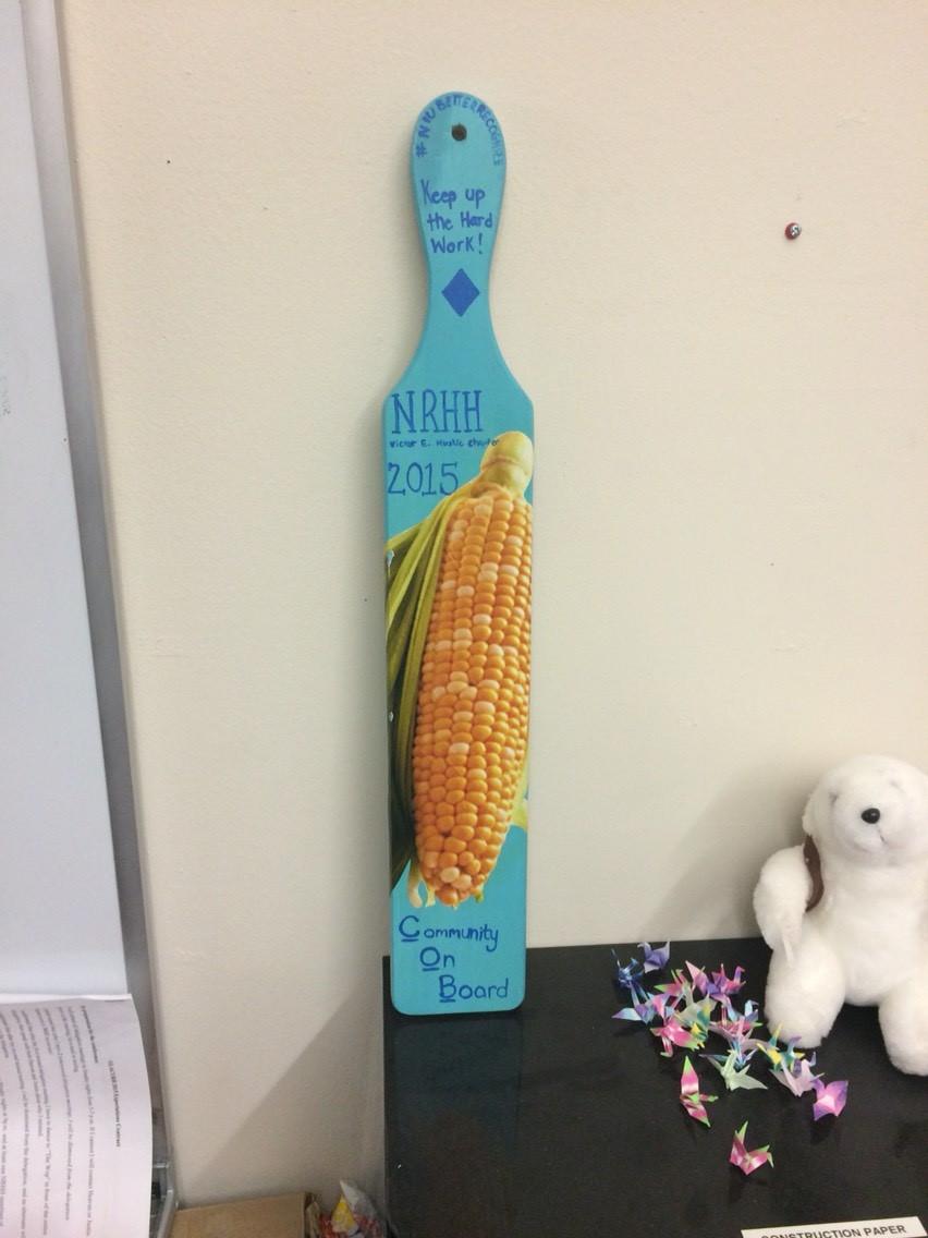 Board (COB) paddle. The paddle is decorated like a cob of corn to embrace our hometown of Dekalb.