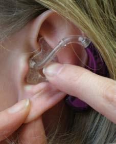 c) Now let go of the back of the earmould and push it into the ear. It may help to pull the ear down and back at the same time.
