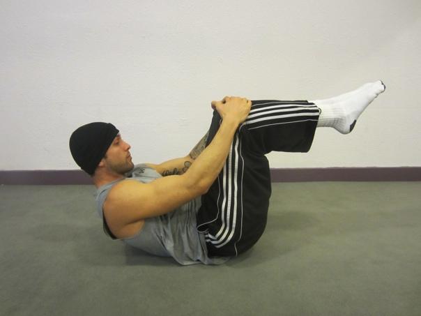 Ø Begin by lying on your back. Ø Chest lift, goal is to have shoulder blades off the floor. Ø Lift both feet off the floor while keeping the knees bent at 90 degrees.
