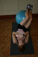 Place your legs over a ball so that the Dissociate the Hips from the lumbar spine muscles at the back of your lower legs (calves) are on the ball.