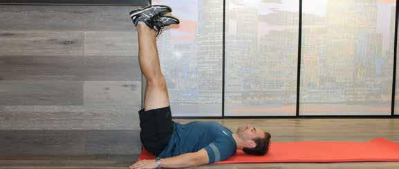 Keeping the bottom leg straight and vertical, slowly lower the other leg. Keep the toes vertical throughout.