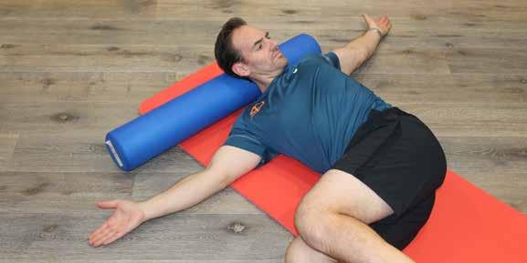 21 Side Thoracic Stretch Side Thoracic Stretch Position yourself on your side,