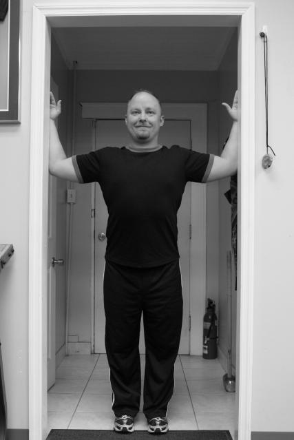 The Wellness Practice Doorway Stretch Stand in doorway with shoulders and elbows at right angles keep head pulled back and chin slightly