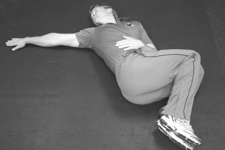 Supine Hip Rotators (Low Back) Lie prone on your back with knees together and bent at 90-degrees and one arm at your side and the other out