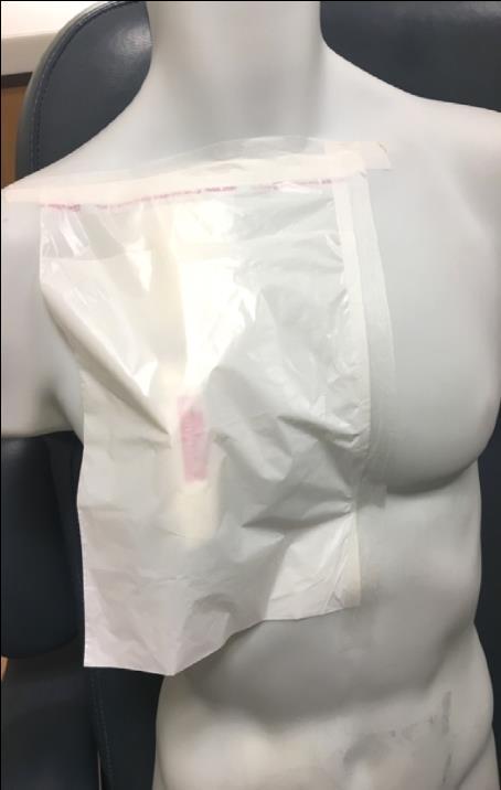Flip the plastic bag down and tape either right side