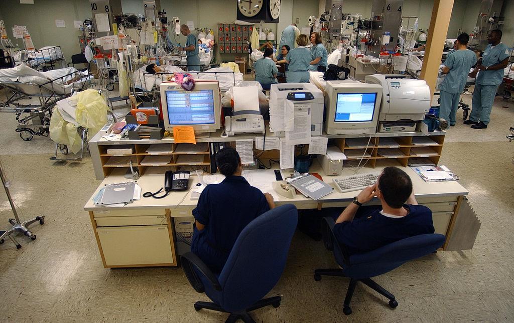 ICU nurses monitoring patients
