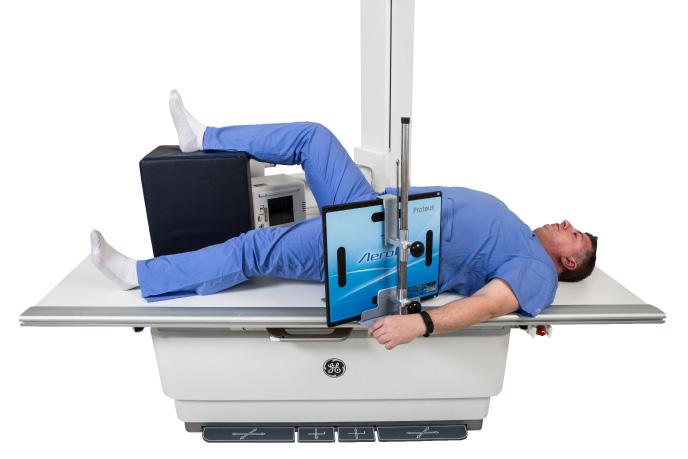 Cross table hip - left Patient supine on the table, arms across upper chest Cushion for patients head Flex and elevate unaffected leg so that the thigh is as near vertical position as possible and