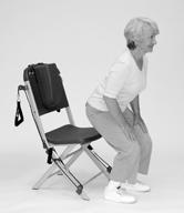 Lean forward, transferring weight to legs as you lift your bottom off the chair. (). 3.