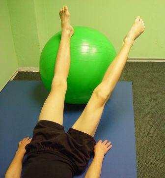 6. LEG CIRCLES: Lie on your back with arms next to your sides.