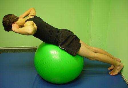 SEATED CRUNCH: Lie with the ball     until
