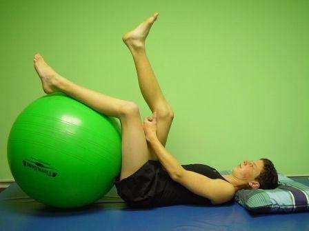 SHOULDER STRETCH Kneel with the ball in front of your head. Place one hand at a time on the ball.