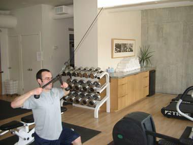 Hold the rope at arm s length above your head Using your upper