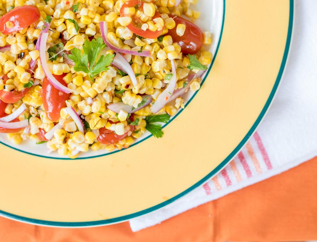 GRILLED CORN & TOMATO SALAD WITH LIME CHILI VINAIGRETTE Ingredients VINAIGRETTE: ½ cup fresh lime juice (about limes) teaspoons ground cumin 1 teaspoon mild chili powder 1 teaspoon salt teaspoons