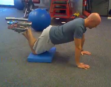 Kneeling Push-up Keep the abs braced and body in a straight line from toes/knees to shoulders.