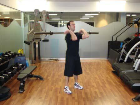 Step under the bar and rest the barbell the anterior deltoids (shoulders).