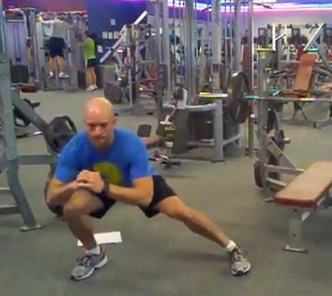 Take a large step sideways (laterally) with one leg into a wide squat position.