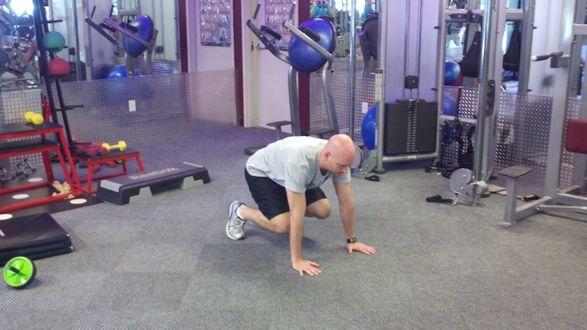 Squat down on your feet and hands Kick your feet out to form a pushup position Perform a